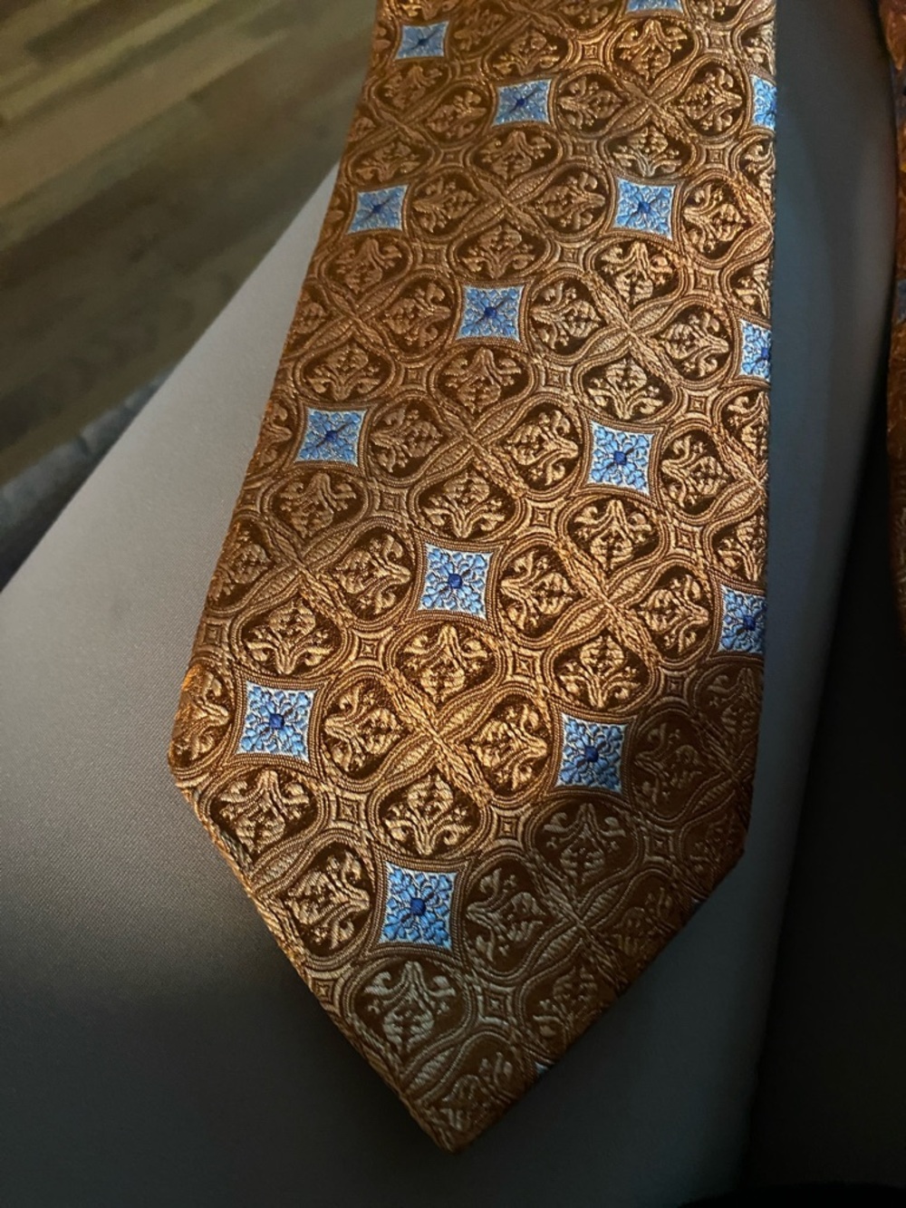 Men's Brown Silk Tie with Blue Medallion Pattern
